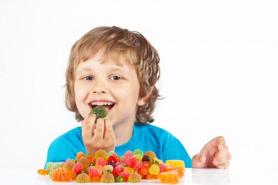 Kid eating a gummy